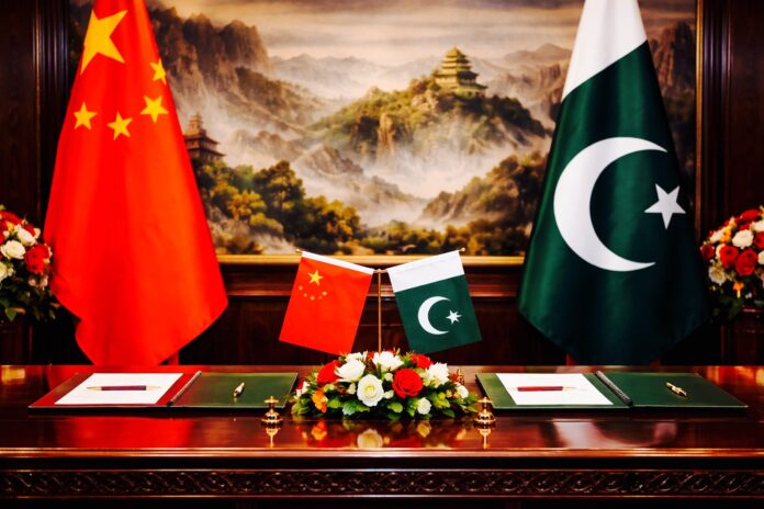 Pakistan and China flags displayed during signing ceremony for investment agreements