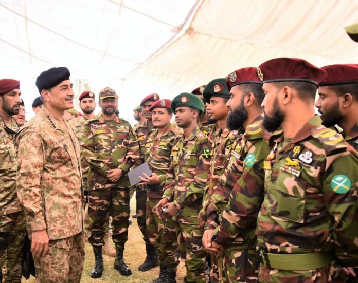 Pakistan Army officers interact with foreign troops during joint military exercise